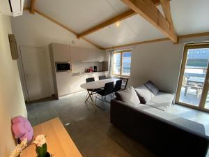 a living room with a couch and a table at Westhinder II H9 in Witte Burg