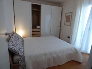מיטה או מיטות בחדר ב-Apartment Mare e Laguna
