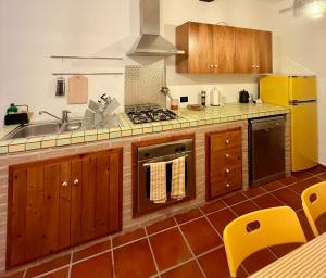 a kitchen with a sink and a stove at TraMonti e Mare in Scalea +18 photos