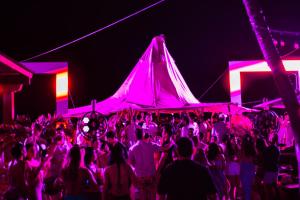 a group of people dancing at a party at night at Wala Hotel and Beach Club in Cartagena de Indias +162 photos