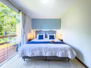 En eller flere senge i et værelse på EstrelaMar Ferradura Restaurante & Spa + 114 billeder