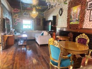 a living room with a table and a couch at Bardak hostel in Cusco
