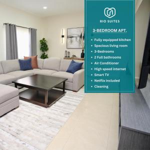 a living room with a couch and a table at Rio Suites in Tijuana
