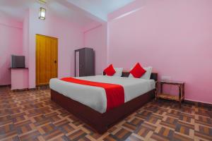 Ένα ή περισσότερα κρεβάτια σε δωμάτιο στο Hotel O Padma +14 φωτογραφίες