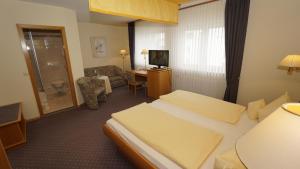 Postel nebo postele na pokoji v ubytování Hotel Anika