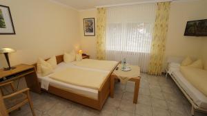 Postel nebo postele na pokoji v ubytování Hotel Anika