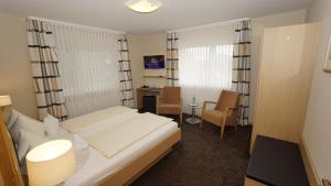 Postel nebo postele na pokoji v ubytování Hotel Anika