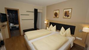 Postel nebo postele na pokoji v ubytování Hotel Anika