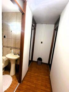 a bathroom with a sink and a toilet at Casa Ñusta- Living culture & regenerative tourism in Cusco +11 photos