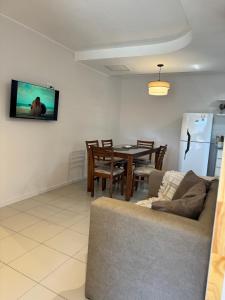 a living room with a couch and a table at corazón de Maipú in Maipú +20 photos