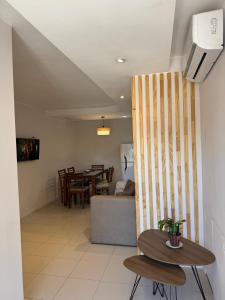 a living room with a table and a couch at corazón de Maipú in Maipú