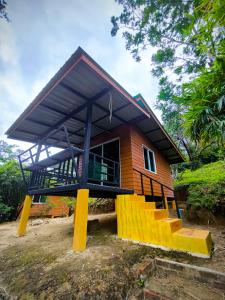 a small house with a large roof at Ta Dang Bay - Bungalow in Koh Chang Ranong