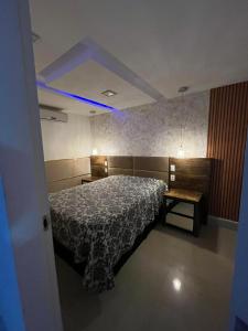 Postel nebo postele na pokoji v ubytování Mar do Cabo Suítes