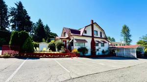 a house with a parking lot in front of it at Private Room with Shared Amenities 10 Minutes to Airport and Walking Distance to Bus Station in Seattle