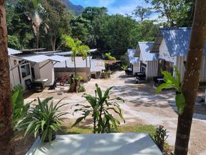 a group of houses in a village with trees at Tuk Tuk Guesthouse in Ko Chang