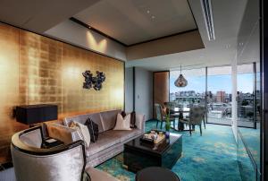 a living room with a couch and a table at Espacio Nagoya Castle in Nagoya
