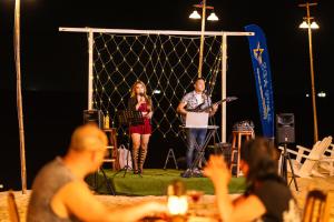 a man and a woman on a stage with a microphone at Sea Star Resort in Phú Quốc +132 photos