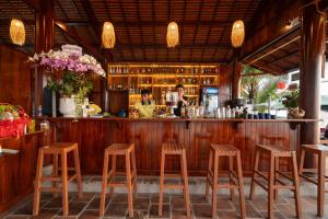 a bar with wooden stools in a restaurant at Sea Star Resort in Phú Quốc