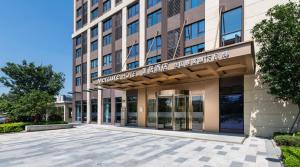 a rendering of the front of a building at Mercure Shanghai Jiuting in Shang-hai +43 photos