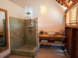a bathroom with a sink and a shower at Villa Kahuna Rote Island in Nembrala +51 photos
