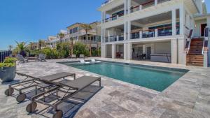 a swimming pool in the backyard of a house at 710 Ocean Boulevard AvantStay Oceanfront Private Pool Rooftop Deck in Mount Pleasant