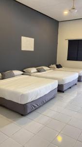 Ένα ή περισσότερα κρεβάτια σε δωμάτιο στο Bayu Cenang 5paxs +4 φωτογραφίες