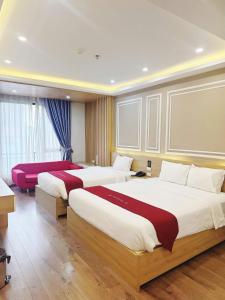 Postel nebo postele na pokoji v ubytování Hotel Villa Ju