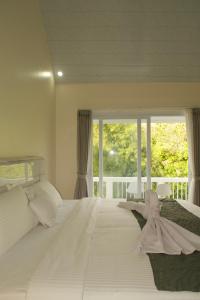 Postel nebo postele na pokoji v ubytování Villa Pangkung