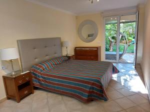 a bedroom with a large bed and a mirror at A 4 floors house with a large capacity in Los Cristianos +54 photos