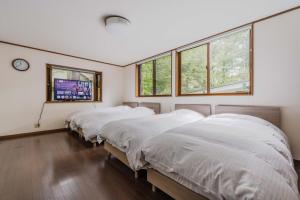 Postel nebo postele na pokoji v ubytování T&A Resort&Sauna KARUIZAWA + 73 fotografií