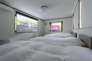 Postel nebo postele na pokoji v ubytování T&A Resort&Sauna KARUIZAWA