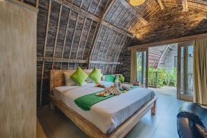 Postel nebo postele na pokoji v ubytování Sunshine Village Canggu + 32 fotografií