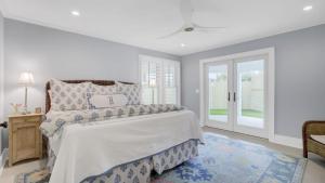 a bedroom with a bed and a window at 6 36th Avenue by AvantStay Stunning Private Pool in Isle of Palms +45 photos