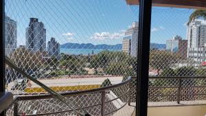 a view of a city skyline from a balcony at Aconchego Floripa Vista Mar in Florianópolis +2 photos