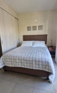 a bedroom with a large bed in a room at Casa Alta California in Tlajomulco de Zúñiga +11 photos