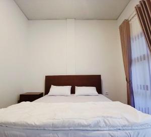 Postel nebo postele na pokoji v ubytování Pandava House Lombok