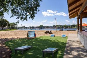 a park with two chairs and a picnic table at AmericInn by Wyndham La Crosse Riverfront-Conference Center in Onalaska