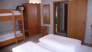 Postel nebo postele na pokoji v ubytování Hotel Anika
