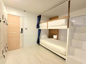 Postel nebo postele na pokoji v ubytování Sira Boutique Chiang Mai