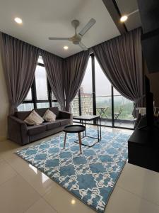 a living room with a couch and a table at D Pristine 3 bedroom residence next to legoland in Iskandar Puteri