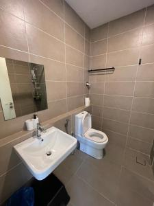 a bathroom with a sink and a toilet at D Pristine 3 bedroom residence next to legoland in Iskandar Puteri