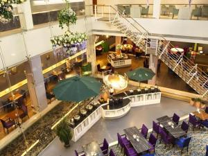 an overhead view of a restaurant with tables and chairs at Catic Hotel--Adjacent Buliding in Zhuhai
