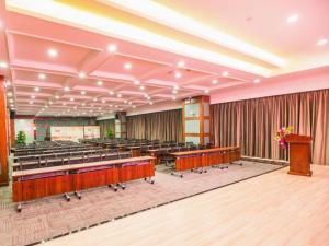 a large lecture hall with chairs and a podium at Lavande Hotel Yichang Railway East Station Branch in Yichang