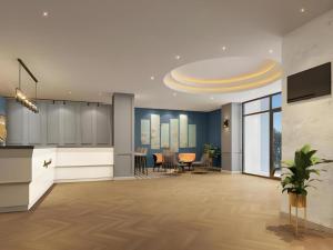 an office lobby with a reception desk and tables at Magnotel Chengdu Kuanzhai Alley Tongjin Bridge Hotel in Chengdu