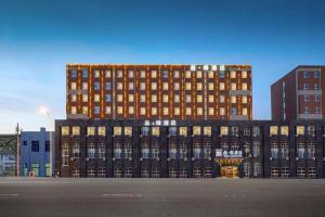 a large building with a lot of windows at James Joyce Coffetel·Changchun Railway Station in Changchun
