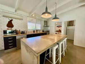 a large kitchen with a large marble counter top at Robe's Hidden Gem - WiFi Pet Friendly Outside in Robe