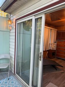 an open sliding glass door on a house at Master Bedroom with Attached SunRoom and Attached Patio in Richmond