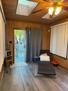 a room with a bed and a ceiling fan at Master Bedroom with Attached SunRoom and Attached Patio in Richmond +9 photos