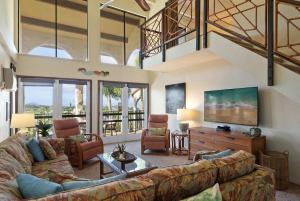a living room with a couch and a tv at Maui Hill 66 · MHL 66 3BD Condo Across from Keawakapu Beach & St in Wailea