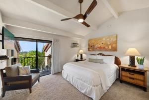 a bedroom with a white bed and a window at Maui Hill 66 · MHL 66 3BD Condo Across from Keawakapu Beach & St in Wailea +44 photos